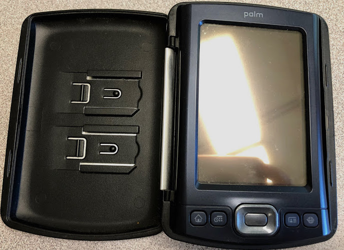 Palm device featuring flip-over cover and stylus